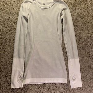 Lululemon white long sleeve top with stains shown in 2nd and 3rd picture